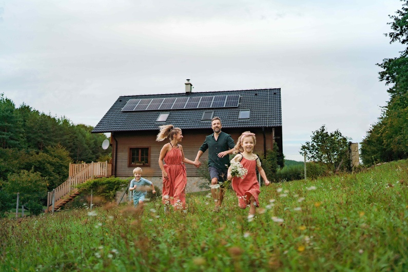 happy-family-running-near-their-house-with-solar-p-2023-11-27-05-25-56-utc-1